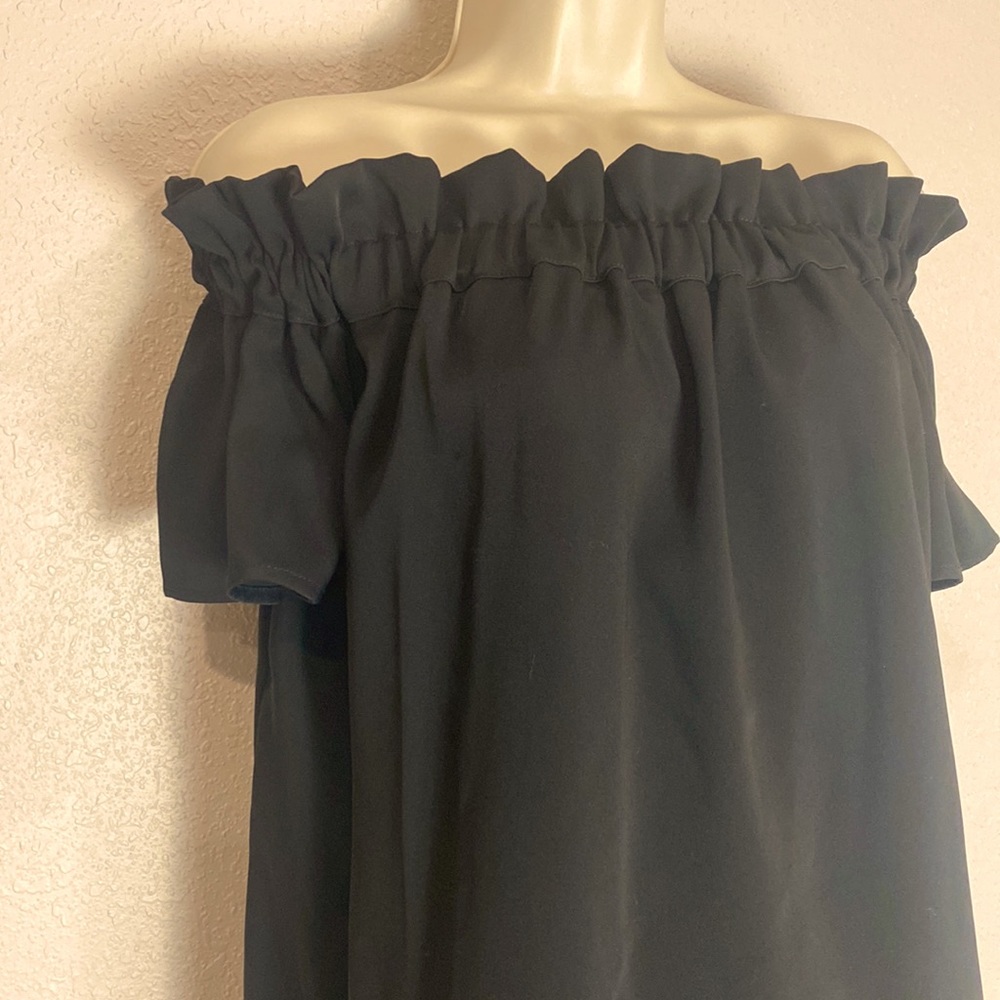 Black mini off the shoulder mini dress.